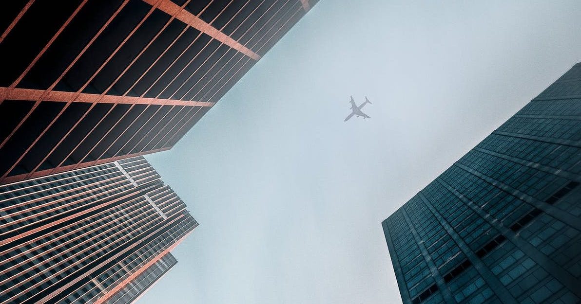 airplane over building
